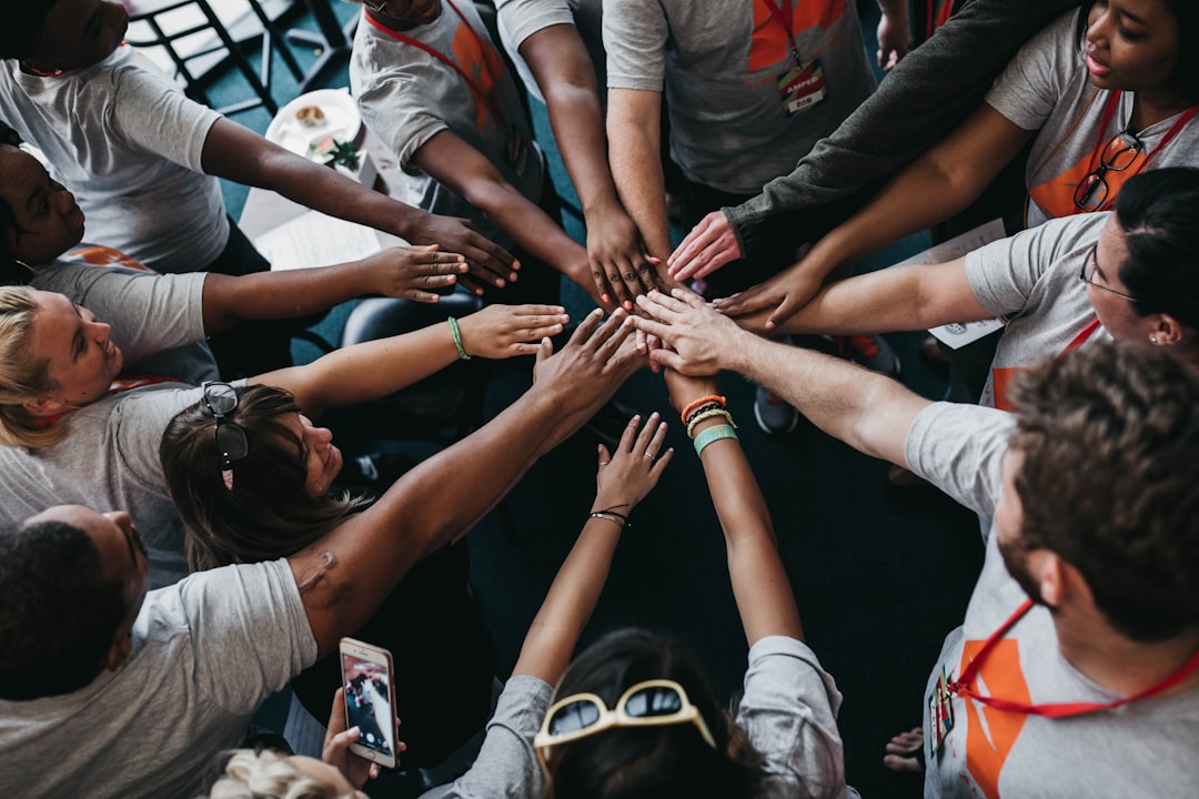 Community members joining hands in unity